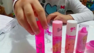 Barbie makeup set tutorial for children . Kit for girls. Cute kids video