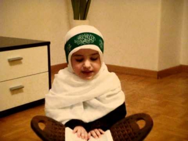 muslim kid reciting Quran (Al Fatiha)