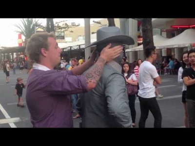 Guy gets punched by street performer! (Original)